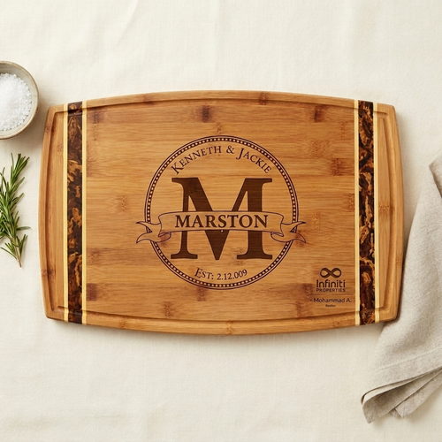 Cutting board with the client's name engraved and a subtle realtor logo in the corner